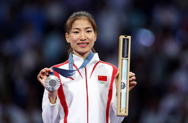 “00后”郭清获得跆拳道项目女子49公斤级决赛亚军，是阳江历史上第一个获得奥运会奖牌的运动员。新华社图片